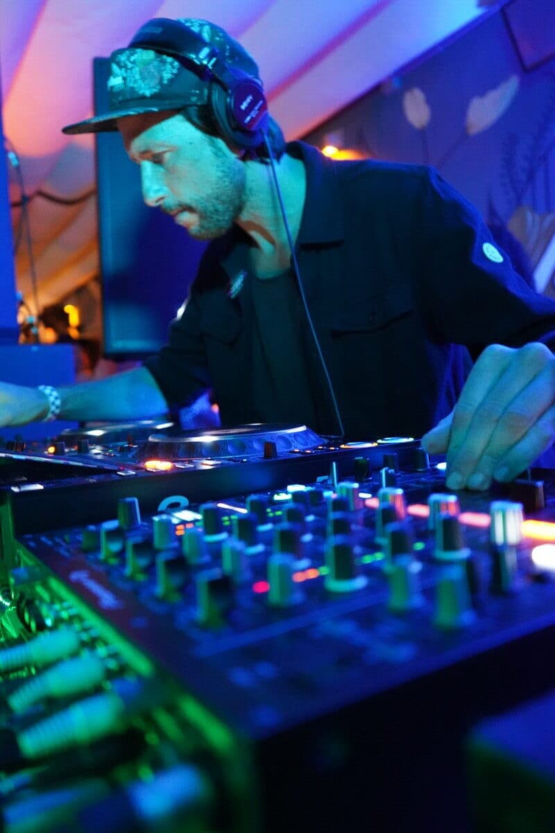 DJ with cap mixing at Essential
