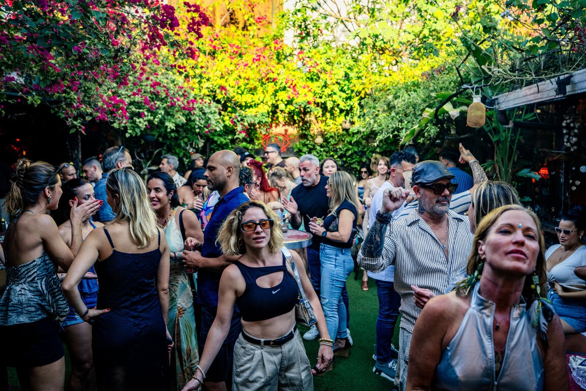 Daytime crowd dancing at ESSENTIAL